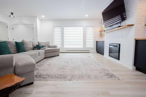 638 9 Avenue, Wainwright, AB - Indoor Photo Showing Living Room With Fireplace