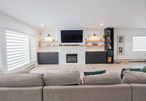 638 9 Avenue, Wainwright, AB - Indoor Photo Showing Living Room With Fireplace
