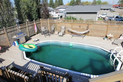 220 1 Avenue East, Maidstone, SK - Outdoor With In Ground Pool With Deck Patio Veranda
