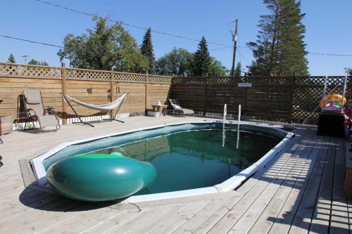 220 1 Avenue East, Maidstone, SK - Outdoor With In Ground Pool With Deck Patio Veranda
