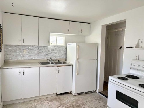 5310 46 Avenue, Vermilion, AB - Indoor Photo Showing Kitchen With Double Sink