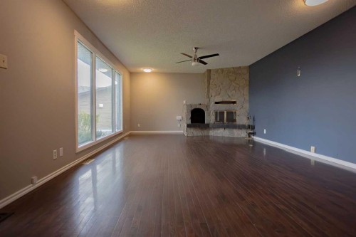 518 3 Street, Wainwright, AB - Indoor Photo Showing Other Room With Fireplace