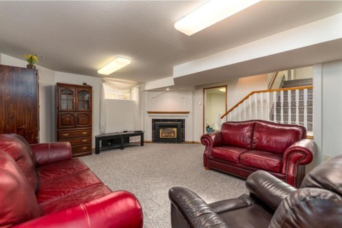 3401 64 Avenue, Lloydminster, AB - Indoor Photo Showing Living Room With Fireplace
