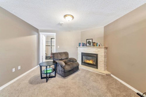 1701 52 Avenue, Lloydminster, AB - Indoor Photo Showing Living Room With Fireplace