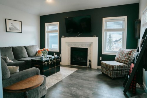 2719 11 Avenue, Wainwright, AB - Indoor Photo Showing Living Room With Fireplace