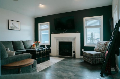 2719 11 Avenue, Wainwright, AB - Indoor Photo Showing Living Room With Fireplace