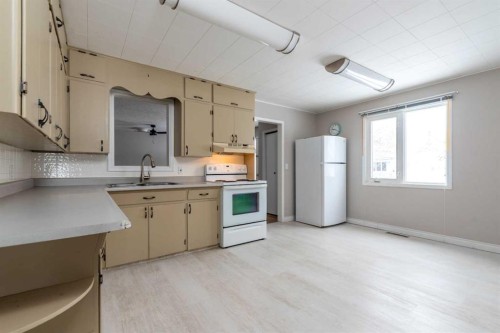 202-1St Street West, Lashburn, SK - Indoor Photo Showing Kitchen With Double Sink