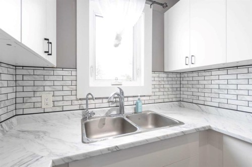 Ab-4810 50 Avenue, Kitscoty, AB - Indoor Photo Showing Kitchen With Double Sink