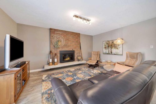 810 10 Avenue, Wainwright, AB - Indoor Photo Showing Living Room With Fireplace