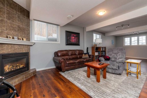 6813 41 Street, Lloydminster, AB - Indoor Photo Showing Living Room With Fireplace