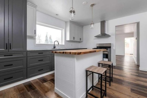 4504 49 Street, Lloydminster, SK - Indoor Photo Showing Kitchen With Fireplace