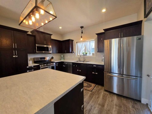 908 8 Avenue, Wainwright, AB - Indoor Photo Showing Kitchen With Stainless Steel Kitchen With Double Sink
