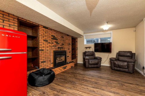 3003 51B Avenue, Lloydminster, AB - Indoor Photo Showing Living Room With Fireplace