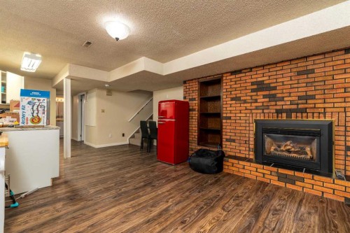 3003 51B Avenue, Lloydminster, AB - Indoor Photo Showing Living Room With Fireplace