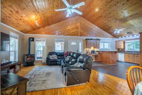 1103 Marblo Place, Brightsand Lake, SK - Indoor Photo Showing Living Room With Fireplace