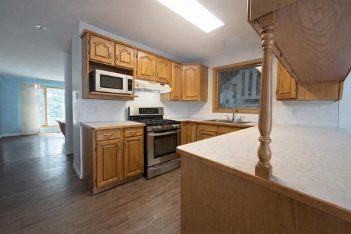 702 10 Avenue, Wainwright, AB - Indoor Photo Showing Kitchen With Double Sink