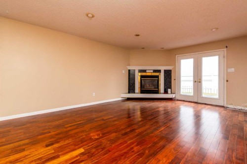 2706 57B Avenue, Lloydminster, AB - Indoor Photo Showing Living Room With Fireplace