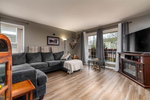 2305 51 Avenue, Lloydminster, AB - Indoor Photo Showing Living Room With Fireplace