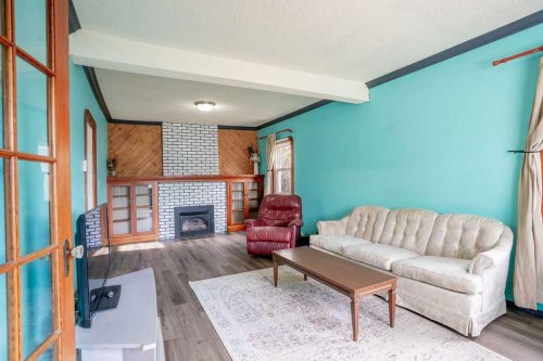 4716 52 Avenue, Vermilion, AB - Indoor Photo Showing Living Room With Fireplace