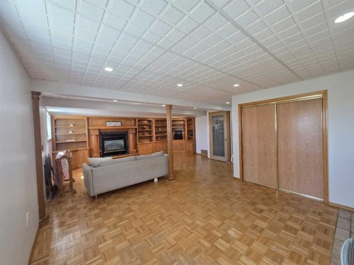 1601 3 Avenue, Wainwright, AB - Indoor Photo Showing Other Room With Fireplace
