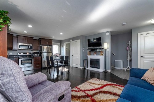 Unit 7-3390 72 Avenue, Lloydminster, AB - Indoor Photo Showing Living Room With Fireplace