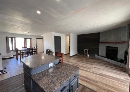 1005 15 Street, Wainwright, AB - Indoor Photo Showing Other Room With Fireplace