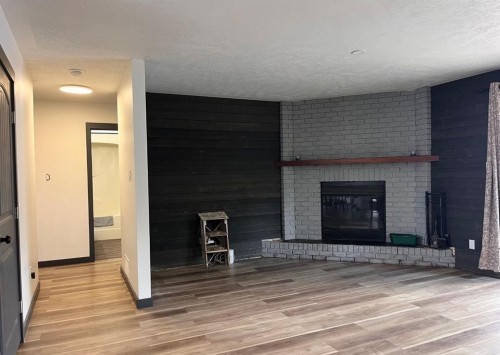 1005 15 Street, Wainwright, AB - Indoor With Fireplace