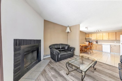 309-3007 57A Avenue, Lloydminster, AB - Indoor Photo Showing Living Room With Fireplace