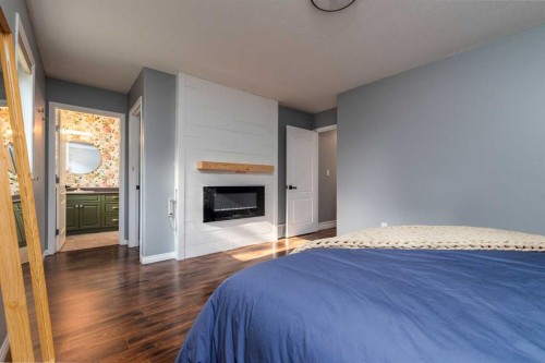 2308 52 Avenue, Lloydminster, AB - Indoor Photo Showing Bedroom With Fireplace