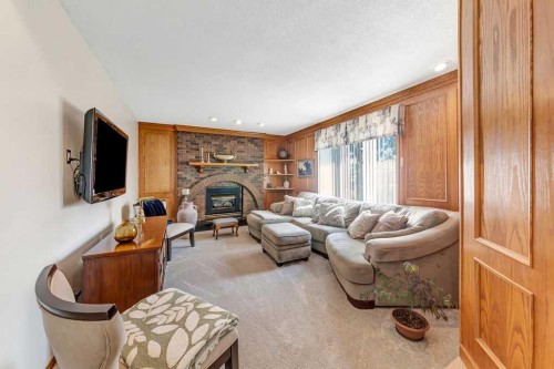 605 22 Street, Wainwright, AB - Indoor Photo Showing Living Room With Fireplace