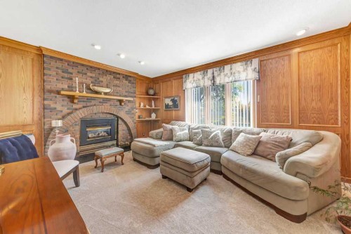 605 22 Street, Wainwright, AB - Indoor Photo Showing Living Room With Fireplace