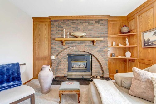 605 22 Street, Wainwright, AB - Indoor Photo Showing Living Room With Fireplace