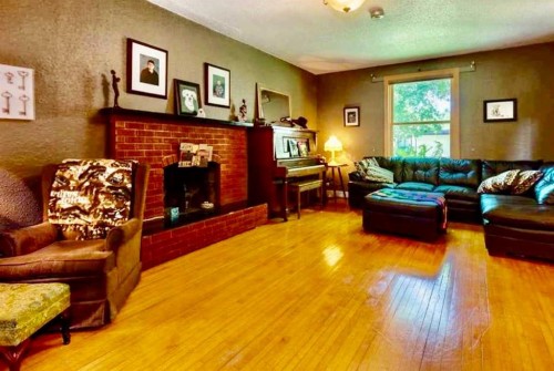 5107 46 Street, Provost, AB - Indoor Photo Showing Living Room With Fireplace