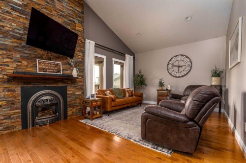 1306 52C Avenue, Lloydminster, AB - Indoor Photo Showing Living Room With Fireplace