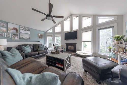 4 Sandpiper Estates, Sandy Beach, AB - Indoor Photo Showing Living Room With Fireplace