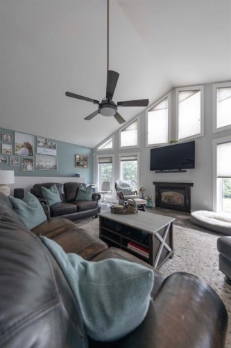 4 Sandpiper Estates, Sandy Beach, AB - Indoor Photo Showing Living Room With Fireplace