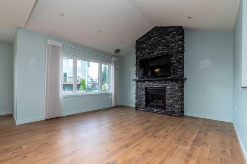 6113 20 Street Close, Lloydminster, AB - Indoor Photo Showing Living Room With Fireplace