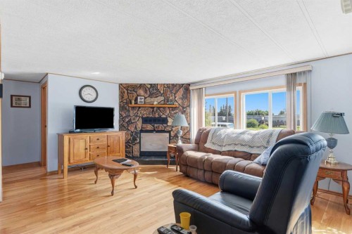 5024 49 Avenue, Kitscoty, AB - Indoor Photo Showing Living Room With Fireplace