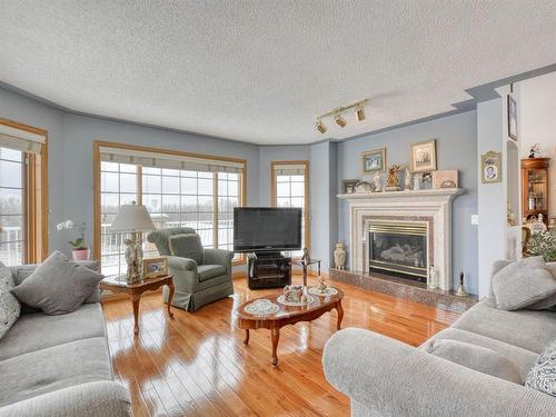 254209 Woodland Road, Rural Rocky View County, AB - Indoor Photo Showing Living Room With Fireplace