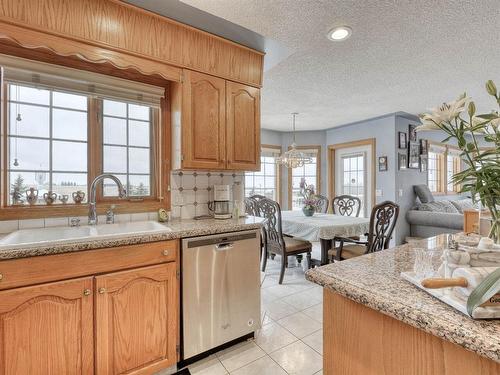 254209 Woodland Road, Rural Rocky View County, AB - Indoor Photo Showing Kitchen With Double Sink