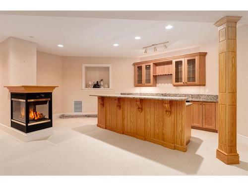 135 Eagle Ridge Drive Sw, Calgary, AB - Indoor With Fireplace
