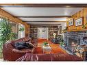 140 Kootenay Avenue, Banff, AB  - Indoor Photo Showing Living Room With Fireplace 