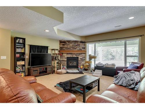 298077 218 Street West, Rural Foothills County, AB - Indoor Photo Showing Living Room With Fireplace