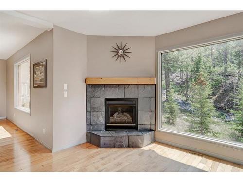7C Otter Lane, Banff, AB - Indoor Photo Showing Living Room With Fireplace