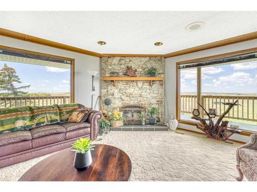 185038 Range Road 241, Milo, AB - Indoor Photo Showing Living Room With Fireplace