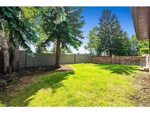 211 Pump Hill Crescent Sw, Calgary, AB - Outdoor With Backyard