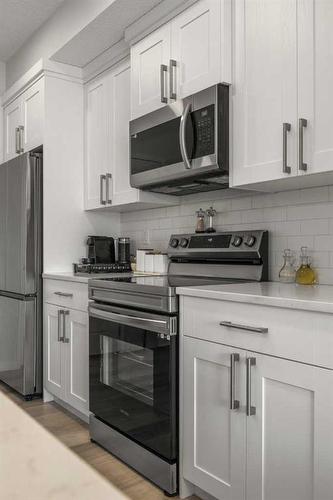 317-80 Carrington Plaza Nw, Calgary, AB - Indoor Photo Showing Kitchen With Stainless Steel Kitchen With Upgraded Kitchen