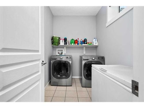 122 Ypres Green Sw, Calgary, AB - Indoor Photo Showing Laundry Room