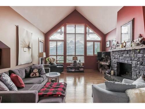 303-801 Benchlands Trail, Canmore, AB - Indoor Photo Showing Living Room With Fireplace