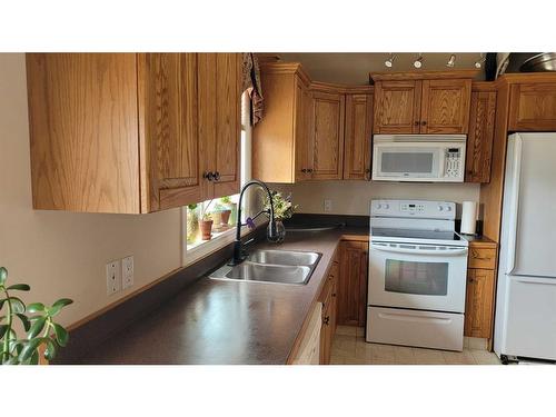 4603 4A Street, Boyle, AB - Indoor Photo Showing Kitchen With Double Sink
